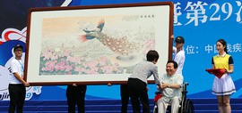 “全国自强模范”著名画家李锐钧为全国残运会特奥会创作巨幅国画《双凤朝阳》