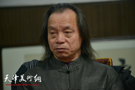 2014年新春艺术界座谈会召开,霍春阳等书画家出席。图为皮恩成