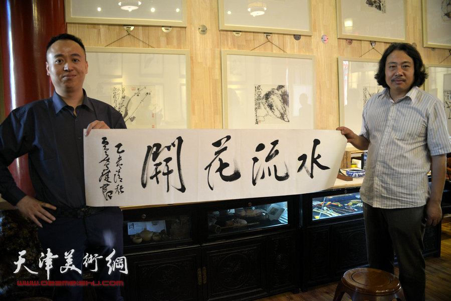 贾广健精品佳作9月13日在集真阁展出，图为贾广健为集真阁题词：水流花开。
