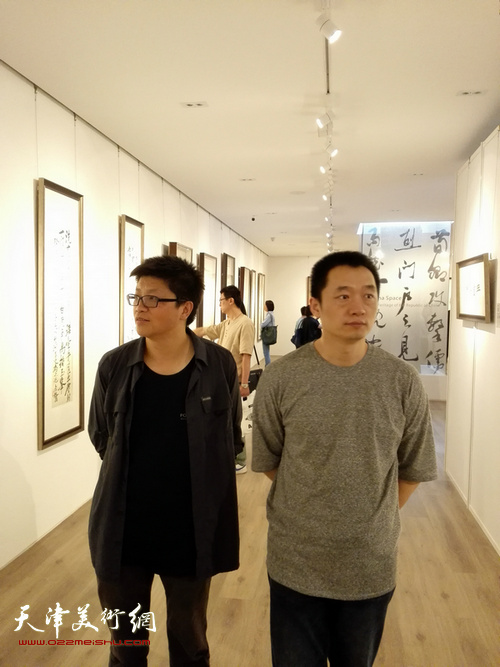 周午生、李旭飞在展览现场