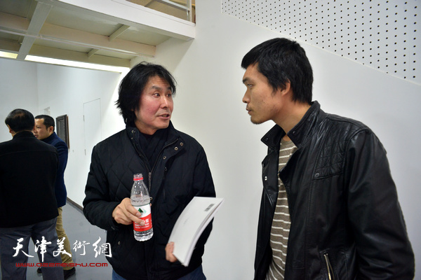 杨熹发、孙毅在展览现场。