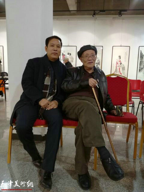 孙长康、徐庆举在画展现场。